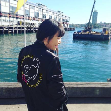 Julie Koh wearing a jacket inspired by The Portable Curiosities